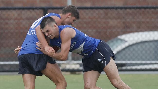 Colby McKercher tackles Harry Sheezel. Picture: Michael Klein