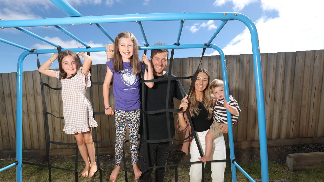 Grace McConvill (centre) with her parents Joel and Renee, little sister Evie and brother George. Picture: Alan Barber