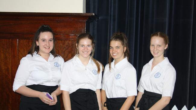 Good Counsel College junior hospitality students Alicia Payne, Bianca O’Connor, Nikita Di Palma and Alana Anderson served at the St Rita's School Melbourne Cup luncheon in the Shire Hall.