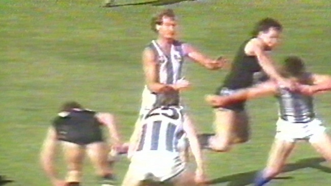 Wayne Johnston belts Alastair Clarkson in retaliation in 1987.