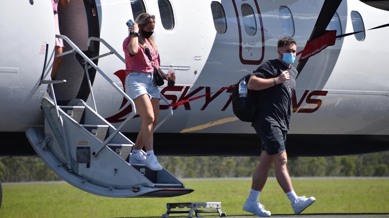 Skytrans' first Cairns to Whitsunday Coast passengers disembark the 34-seater Dash 8-100 at Proserpine on September 13, 2021. Picture: Kirra Grimes