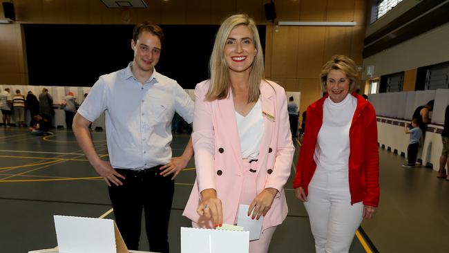 Corinne Mulholland, her partner Davis Murphy and mother Carmel Mulholland, vote at the 2019 federal election, at which Mulholland was Labor’s candidate for Petrie. Picture: David Clark