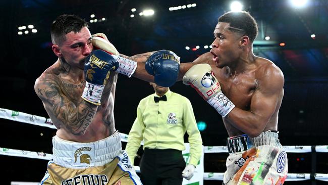 Devin Haney of the United States lands a punch to George Kambosos Jr. Photo by Quinn Rooney/Getty Images