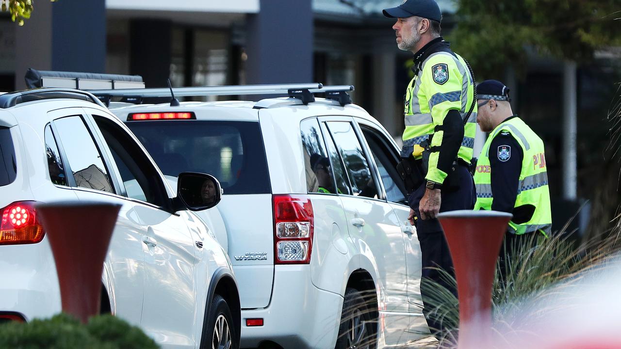 Police check cars at the Queensland border. Picture: Nigel Hallett