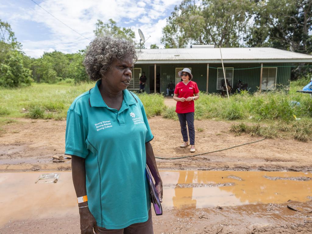 Monica Pilakui and Tracy Porter searching for kids who still need the jab in Wurrumiyanga. Picture: Floss Adams.