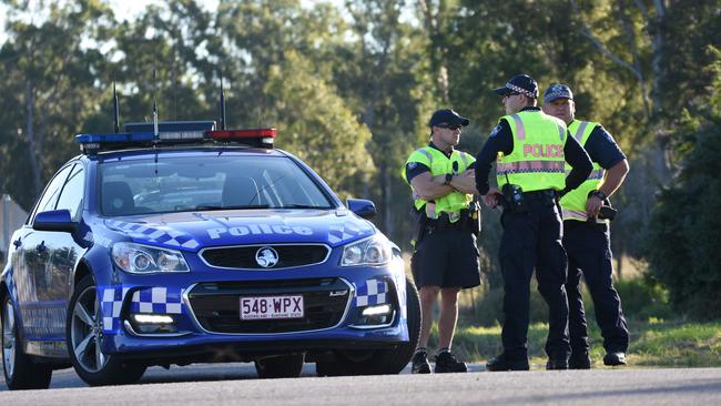 Police enforce an exclusion zone near Gatton as Rick Maddison held officers at bay. Picture: Sarah Motherwell/AAP