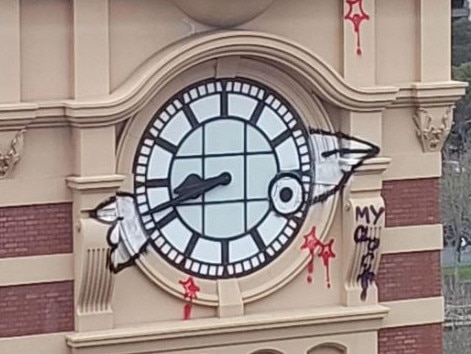 A towering clock face above Flinders Street Station was tagged in July last year.