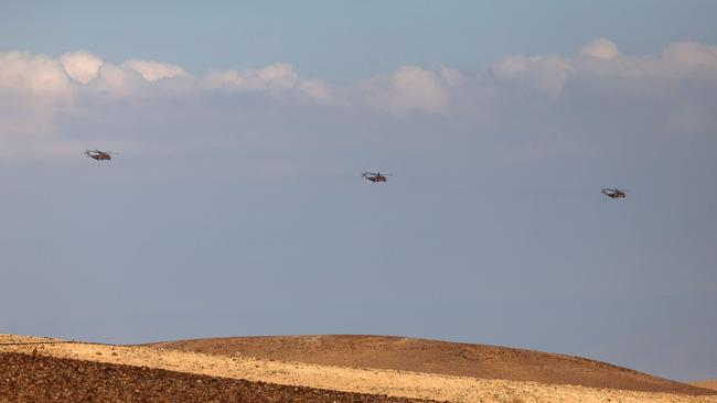 Israeli Air Force heavy lift military transport helicopters fly over in the southern Negev desert. Picture: Ahmad Gharabli/AFP