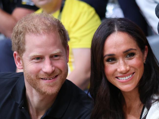 DUESSELDORF, GERMANY - SEPTEMBER 13: Prince Harry, Duke of Sussex and Meghan, Duchess of Sussex  pose for a photograph as they attend the Wheelchair Basketball preliminary match between Ukraine and Australia during day four of the Invictus Games DÃÂ¼sseldorf 2023 on September 13, 2023 in Duesseldorf, Germany. (Photo by Chris Jackson/Getty Images for the Invictus Games Foundation)