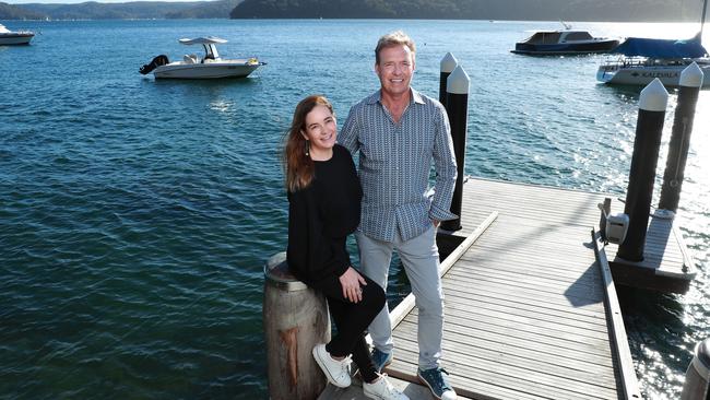 The cofounders of Baillie Lodges, Hayley and James Baillie, on the pier outside their home in Avalon, Sydney. Picture: John Feder