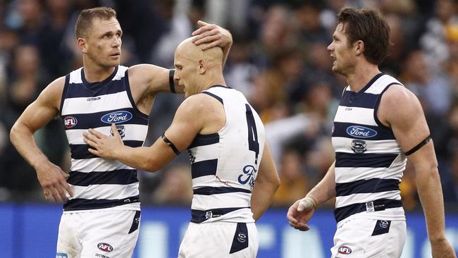 Joel Selwood celebrates a Gary Ablett goal along with Patrick Dangerfield during the Cats’ round five win over Hawthorn. Pic: AAP