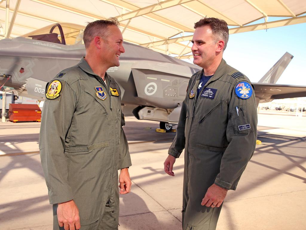 Australian Pilots training in the F35 fighter Jets Luke Airforce Base in Phoenix Arizona. Squadron leader Wing Commander Darren Clare (R) speaks with US Air Force Lieutenant colonel Rhett “Hero” Hierlmeier. Picture: Nathan Edwards