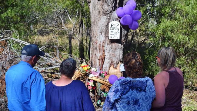 ROADSIDE MEMORIAL: Casey mother Donna Porter and partner, with Clinton Thompsons mother Robin Thompson, and sister Teresa Doyle at the Chinchilla Tara Rd memorial site.