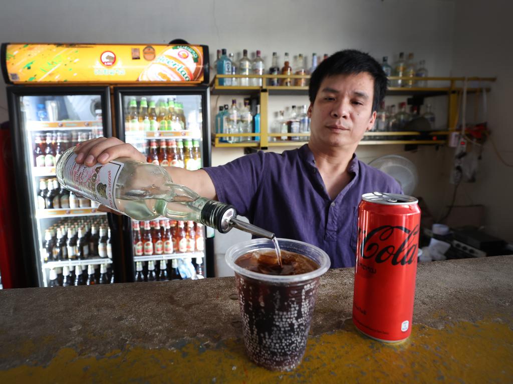 Nana Backpackers Hostel bar tender Toan Van Vanng pours the same vodka and Coke Zero drink the girls had at the hostel’s bar.