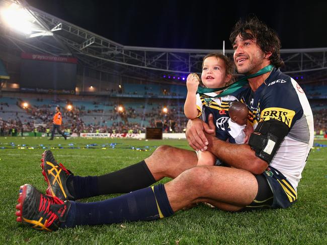 Cowboys captain Johnathan Thurston takes a moment in the centre of the field with his daughter Frankie Thurston after winning the 2015 NRL Grand Final against the Brisbane Broncos. (Photo by Cameron Spencer/Getty Images)