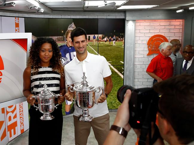 Naomi Osaka and Novak Djokovic with their US Open winner’s trophies. Picture: Julian Finney/Getty Images/AFP