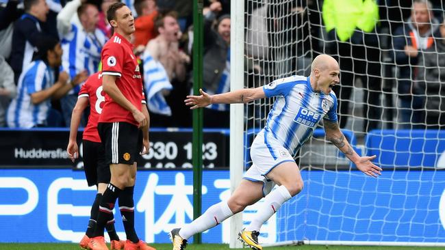 Aaron Mooy of Huddersfield Town celebrates as he scores.