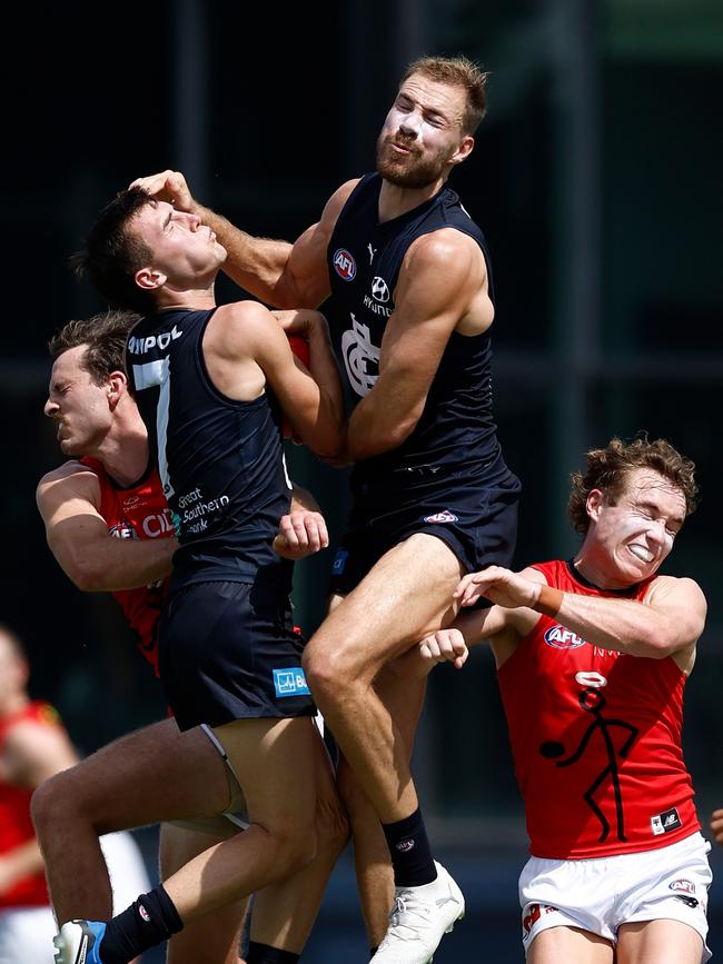 Jagga Smith (left #7) collides with Harry McKay in a marking contest. (Photo by Michael Willson/AFL Photos via Getty Images)