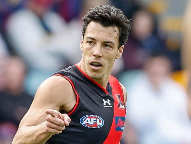 BRISBANE, AUSTRALIA - JULY 10: Dylan Shiel of the Bombers celebrates a goal during the 2022 AFL Round 17 match between the Brisbane Lions and the Essendon Bombers at The Gabba on July 10, 2022 in Brisbane, Australia. (Photo by Russell Freeman/AFL Photos via Getty Images)