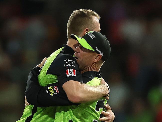 Tom Andrews and David Warner celebrate the Thunder’s win. Picture: Getty Images