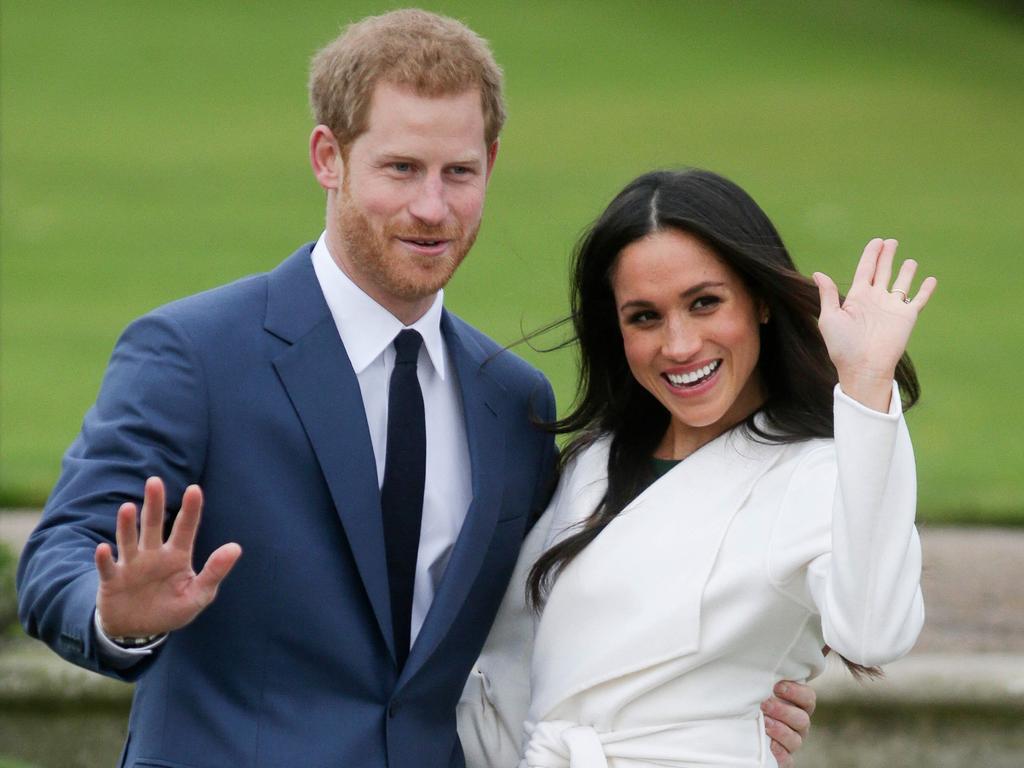 Prince Harry and Meghan Markle pose for a photograph in the Sunken Garden at Kensington Palace following the announcement of their engagement. Picture: AFP