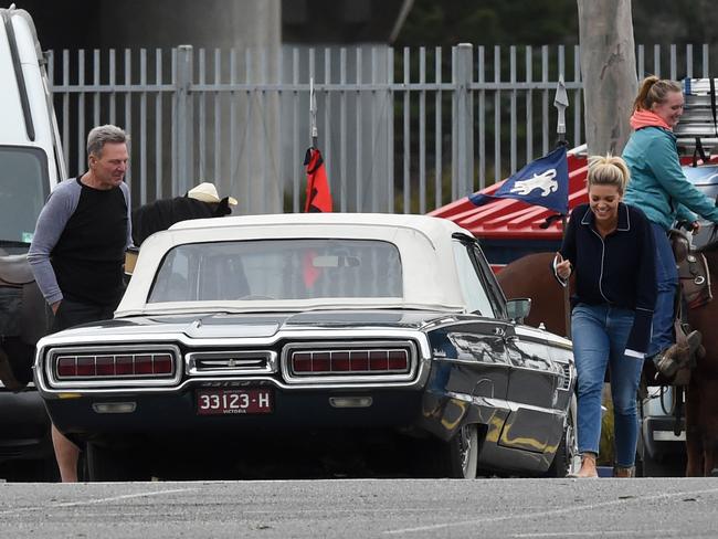 Sam Newman and Bec Maddern appear to share a joke during filming outside The Footy Show’s Docklands studio. Picture: Kylie Else