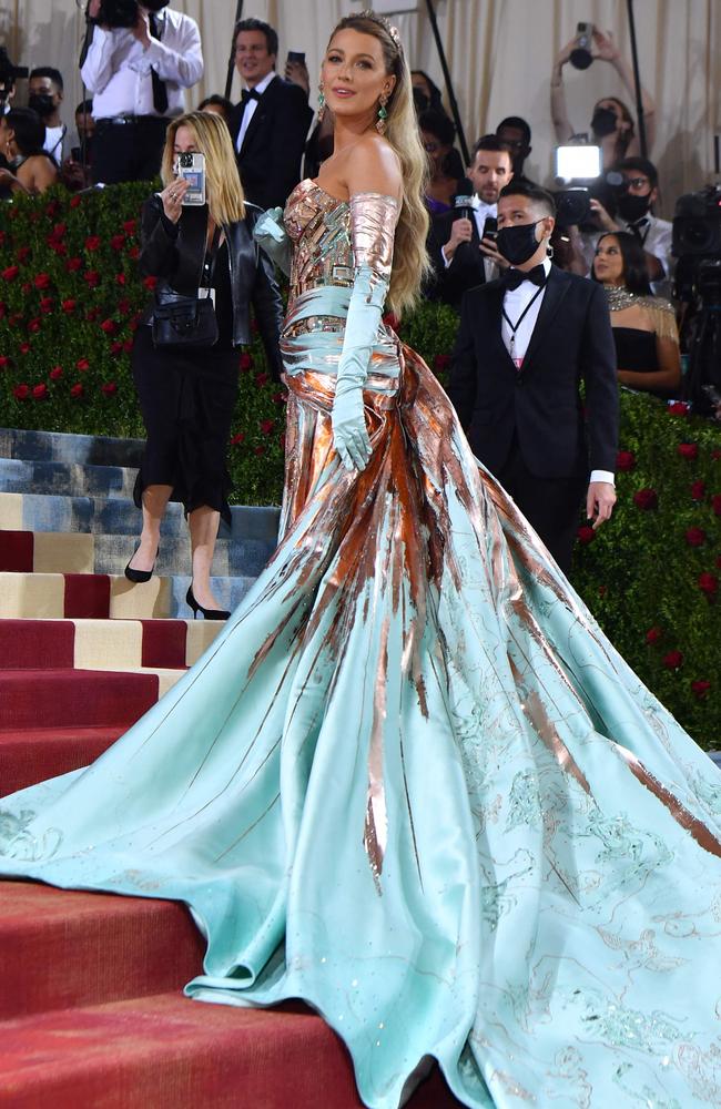 But as it turned out, she was rocking another layer to her dress, which turned her gown from pink to blue. Picture: Angela Weiss/AFP