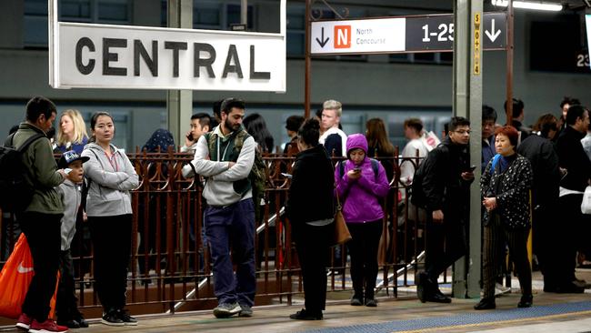 Passengers wait at Central Station after work on overhead lines caused major delays on Saturday. Picture: Damian Shaw