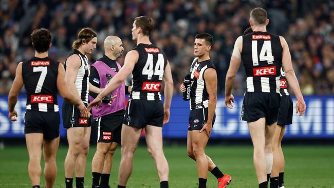 MELBOURNE, AUSTRALIA – JULY 12: Nick Daicos of the Magpies holds his hamstring during the 2024 AFL Round 18 match between the Collingwood Magpies and the Geelong Cats at Melbourne Cricket Ground on July 12, 2024 in Melbourne, Australia. (Photo by Michael Willson/AFL Photos via Getty Images)