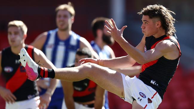 AFL Round 18. North Melbourne vs Essendon at Metricon stadium, Gold Coast . 18/07/2021.   Sam Durham of the Bombers  kicks at goal   .  Pic: Michael Klein