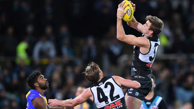 FLYING HIGH: Port Adelaide defender Dougal Howard takes a strong mark against West Coast last week. Picture: David Mariuz (AAP).