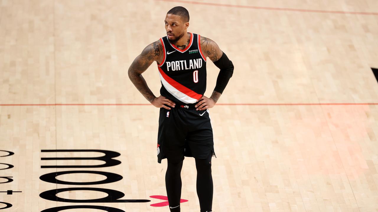 PORTLAND, OREGON - FEBRUARY 20: Damian Lillard #0 of the Portland Trail Blazers reacts in the second quarter against the Washington Wizards at Moda Center on February 20, 2021 in Portland, Oregon. NOTE TO USER: User expressly acknowledges and agrees that, by downloading and or using this photograph, User is consenting to the terms and conditions of the Getty Images License Agreement. (Photo by Abbie Parr/Getty Images)