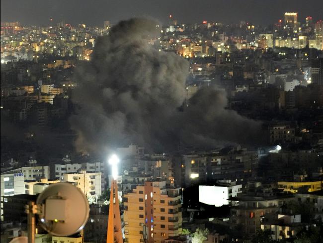 Smoke rises after an Israeli airstrike on Dahiyeh, in the south of Beirut on Friday. Picture: AP / Hussein Malla