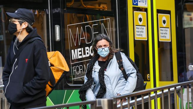 Face masks will become optional for Victorian commuters from 11.59pm on Thursday. Picture: Ian Currie