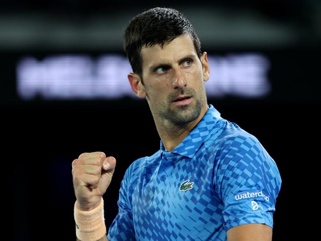 MELBOURNE, AUSTRALIA - JANUARY 17: Novak Djokovic of Serbia celebrates a poin in their round one singles match against Roberto Carballes Baena of Spain during day two of the 2023 Australian Open at Melbourne Park on January 17, 2023 in Melbourne, Australia.  (Photo by Clive Brunskill/Getty Images)