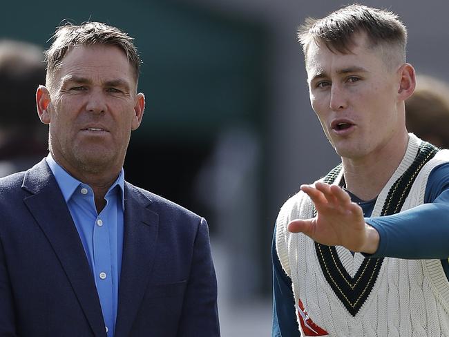 MANCHESTER, ENGLAND - SEPTEMBER 05: Former Australian Cricketer Shane Warne works with Marnus Labuschagne of Australia on his bowling during day two of the 4th Specsavers Test between England and Australia at Old Trafford on September 05, 2019 in Manchester, England.