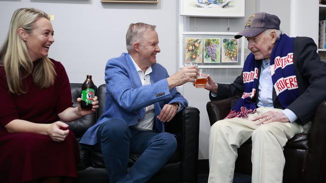 Anthony Albanese (centre) and his partner Jodie Haydon (left) visit 103-year-old WWII veteran Frank McGovern. Picture: Tim Hunter