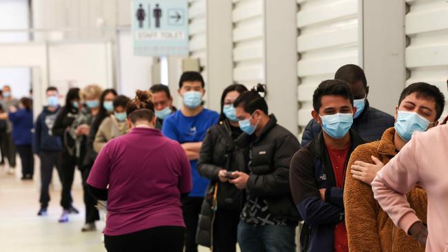 Aged care and disability care workers line up for their vaccine at the Melbourne Showgrounds. Picture: NCA NewsWire / Ian Currie