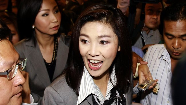 Exiled Thaksin vows to stay mum as sister takes power | The Australian