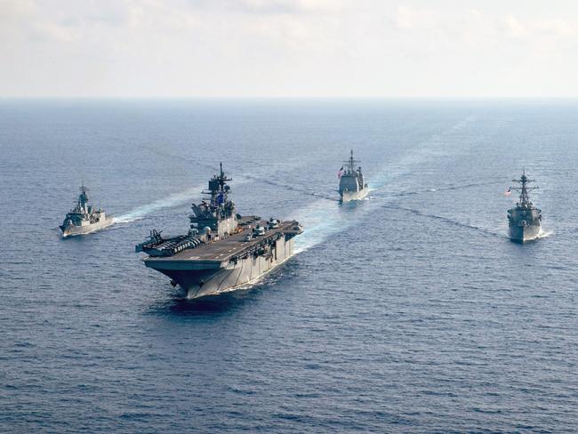 The Royal Australian Navy guided-missile frigate HMAS Parramatta (FFH 154), left, is underway with the U.S. Navy amphibious assault ship USS America (LHA 6), the Ticonderoga-class guided-missile cruiser USS Bunker Hill (CG 52) and the Arleigh-Burke-class guided-missile destroyer USS Barry (DDG 52).