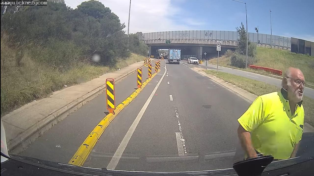 A man in a high-vis shirt exits his car and starts berating the truck driver. Picture: Facebook.