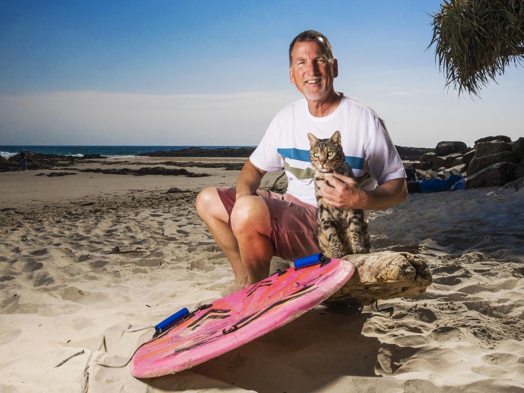 Boomer and owner Robert Dollwet - Longest human tunnel travelled through on a skateboard by a cat,13 people. Picture: Nigel Hallett