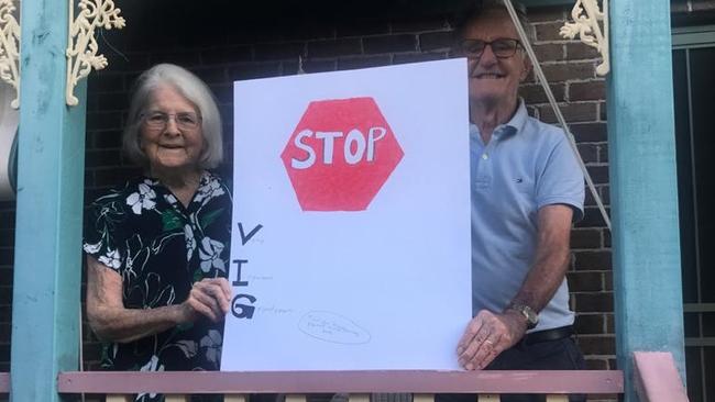 VIGs: Margaret and Brian with their granddaughter’s sign. Picture: supplied