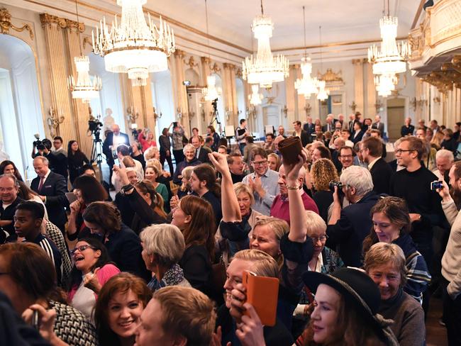 The audience reacts as Permanent Secretary of the Swedish Academy Sara Danius announces that Bob Dylan is awarded the 2016 Nobel prize in Literature. Picture: AFP