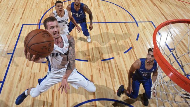 Josh Adams #14 of the Dallas Mavericks goes to the basket against the Golden States Warriors during the 2018 Las Vegas Summer League on July 9, 2018 at the Thomas &amp; Mack Center in Las Vegas, Nevada. (Photo by Garrett Ellwood/NBAE via Getty Images)