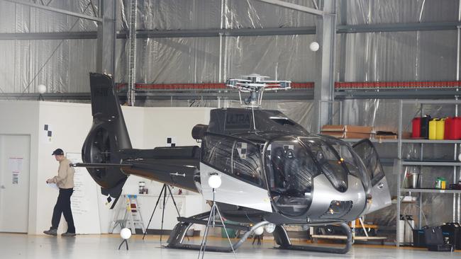 ATSB officers continue their helicopter crash investigations at the Seaworld Helicopter Hangar on the Spit. Picture: Glenn Hampson.