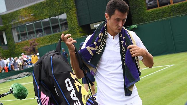 Did you see Tomic pretend during his disastrous game to have something wrong with his back, rather than his head? Picture: AFP