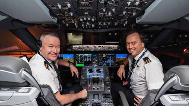 Qantas pilot Sean Golding and first officer Jeremy Sutherland in the cockpit of a Qantas Boeing 787 Dreamliner, which would fly the Brisbane-Chicago route. Picture: James D Morgan