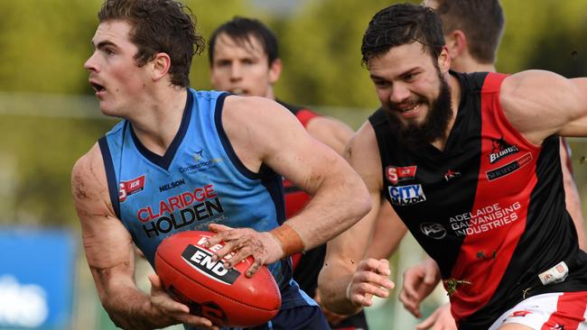 Sturt's Joshua Hone breaks away from West's Mason Middleton as the Blues cruise to a huge win. Picture: Tom Huntley