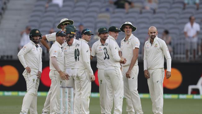 Australian players wait for a DRS review. Picture: AP